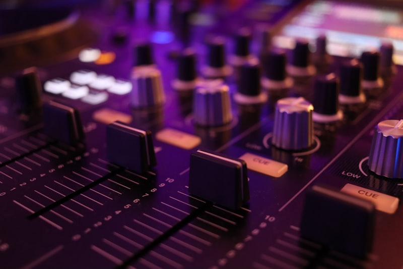 Mixing board sliders in the studio